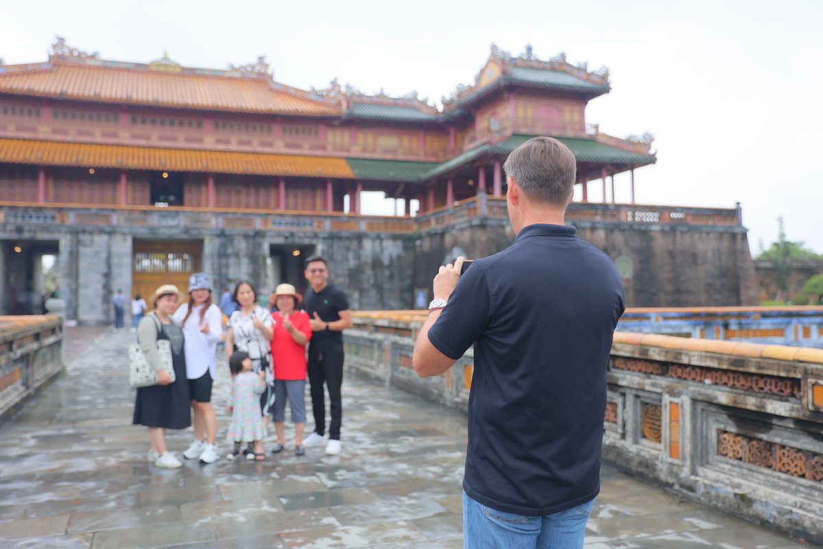 group poses for photo in vietnam