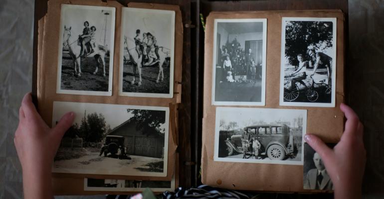 hands holding a photo album