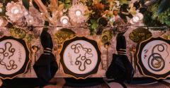 table setting with snake motifs