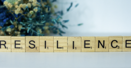 scrabble tiles spelling "Resilience"